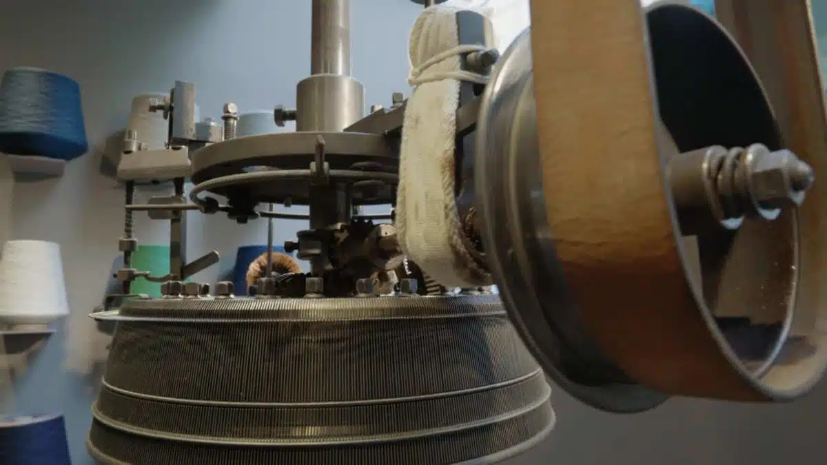 Close up shot of a machine used to make loopwheel t-shirts